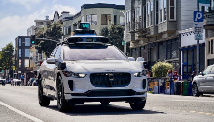 The image shows a Jaguar I-Pace, Waymo Ones cab. — Waymo