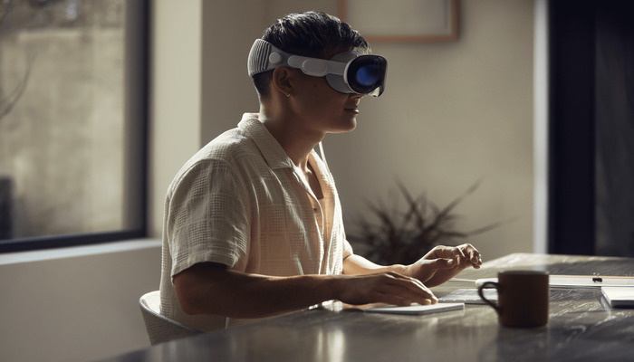 An undated image displaying a man wearing Vision Pro. — Appletoolbox