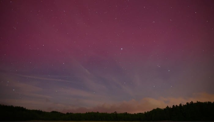 An undated image of Auroras over the lake near Szczytno, Poland. — Reuters