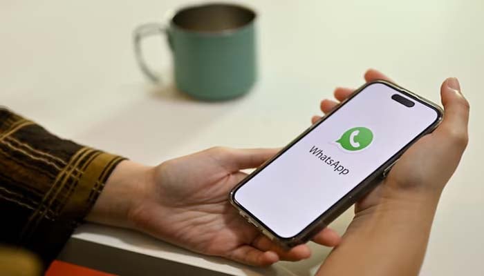 An undated image of a person using WhatsApp. — Freepik