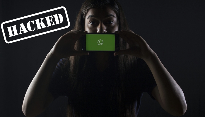 A representational image of WhatsApp being hacked. — Unsplash/Canva