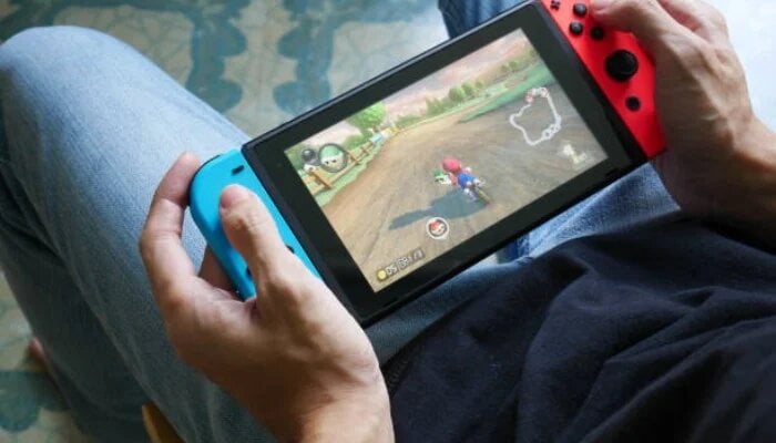 An undated image of a person playing on Nintendo Switch. — Unsplash