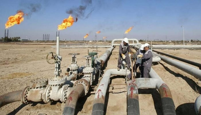 An undated image showing workers working on a site. — Online