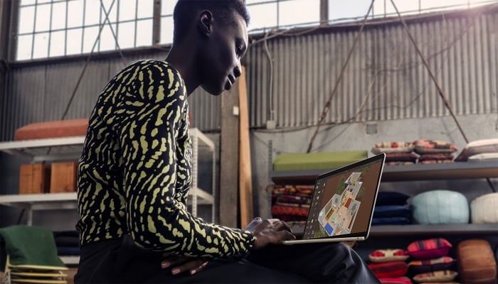 An undated image of a person using the Apple Macbook Air M3. — Apple