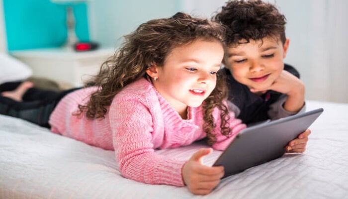 An undated image of kids using a tablet. — iStock