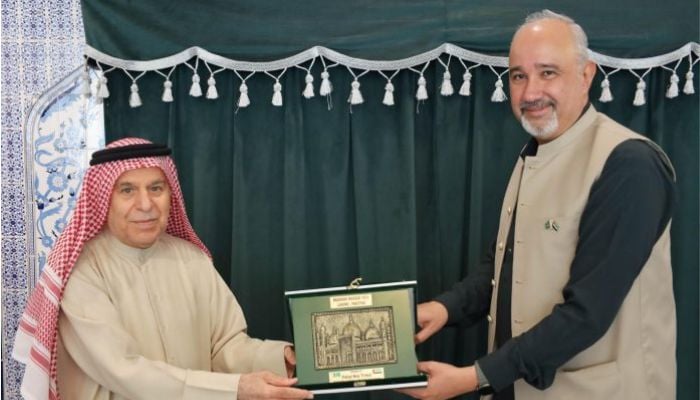 An image of Pakistans Ambassador to the UAE Faisal Niaz Tirmizi with of Lari Exchange Chairman Abbas Darwish Lari. — APP