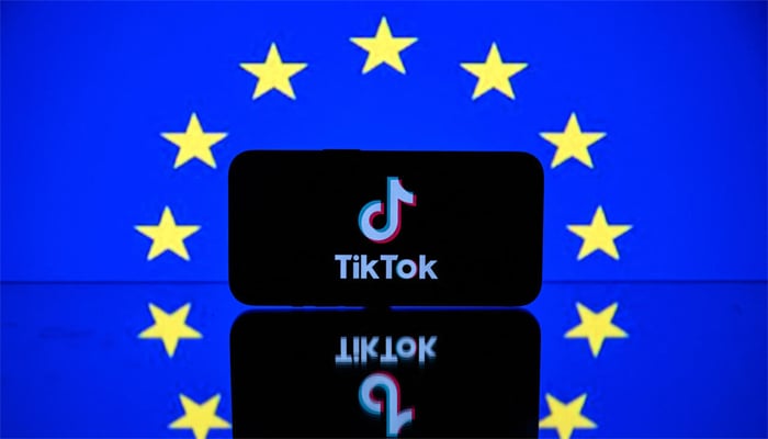 This picture taken on April 26, 2023 in Toulouse, southwestern France, shows a screen displaying the TiktTok social media platforms logo and the European flag. — AFP