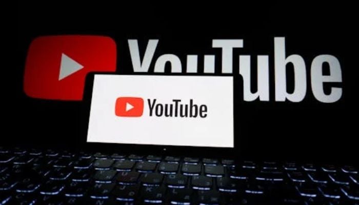 An undated image of YouTube app displayed on smartphone along with in background. — Pexels