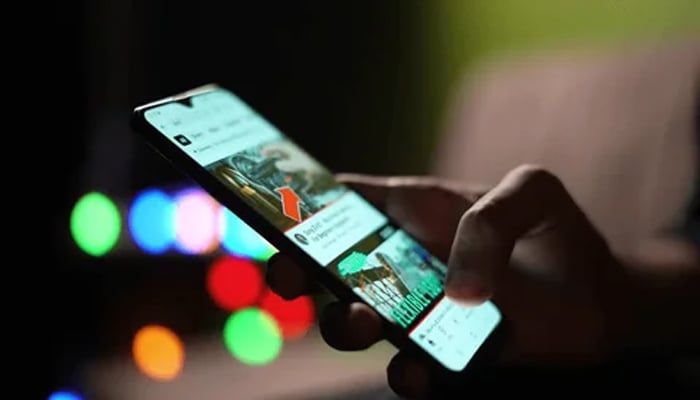 An undated image of a person using social media platform on smartphone. — Shutterstock